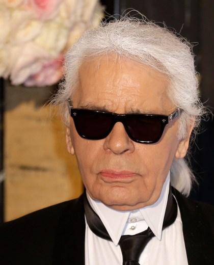 FILE - In this Saturday, March 28, 2015 file photo, Karl Lagerfeld poses for photographers as he arrives at the Rose Ball in Monaco. The Rose Ball is the traditional annual charity event in the Principality of Monaco. Chanel¿s iconic couturier, Karl Lagerfeld, whose accomplished designs as well as trademark white ponytail, high starched collars and dark enigmatic glasses dominated high fashion for the last 50 years, has died. He was around 85 years old. (AP Photo/Lionel Cironneau, File) France Obit Lagerfeld