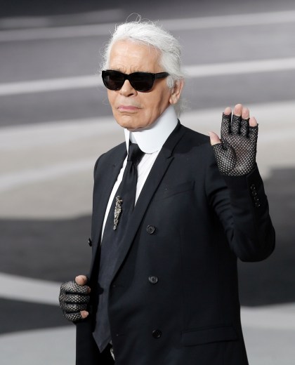 FILE - In this Tuesday, March, 5, 2013 file photo, Karl Lagerfeld acknowledges applause at the end of his Fall/Winter 2013-2014 ready to wear collection for Chanel presented, in Paris. Chanel's iconic couturier, Karl Lagerfeld, whose accomplished designs as well as trademark white ponytail, high starched collars and dark enigmatic glasses dominated high fashion for the last 50 years, has died. He was around 85 years old. (AP Photo/Christophe Ena, File) France Obit Lagerfeld