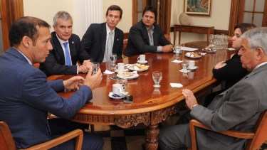 Omar Gutiérrez y Oscar Massei, durante una reunión en el Tribunal Superior de Justicia. (Archivo)