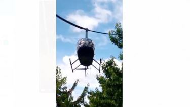 La fuerza de las aspas del helicóptero genera un fuerte movimiento descendente del aire que libera la humedad que quedó en las cerezas tras las lluvias. Foto: Captura de Video. 