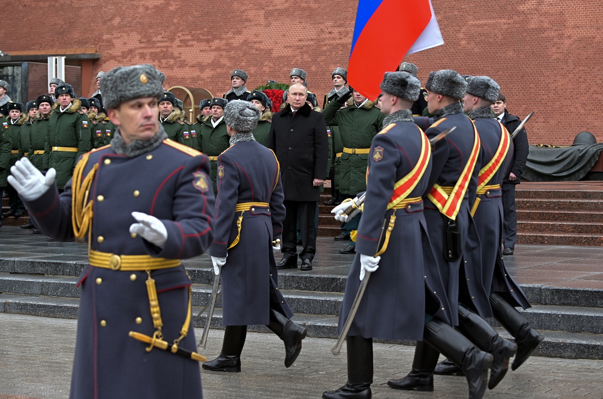 Russian President Vladimir Putin, center, attends a wreath-laying ceremony at the Tomb of the Unknown Soldier, near the Kremlin Wall, during the national celebrations of the 'Defender of the Fatherland Day' in Moscow, Russia, Wednesday, Feb. 23, 2022. The Defenders of the Fatherland Day, celebrated in Russia on Feb. 23, honors the nation's military and is a nationwide holiday. (Alexei Nikolsky, Kremlin Pool Photo via AP)