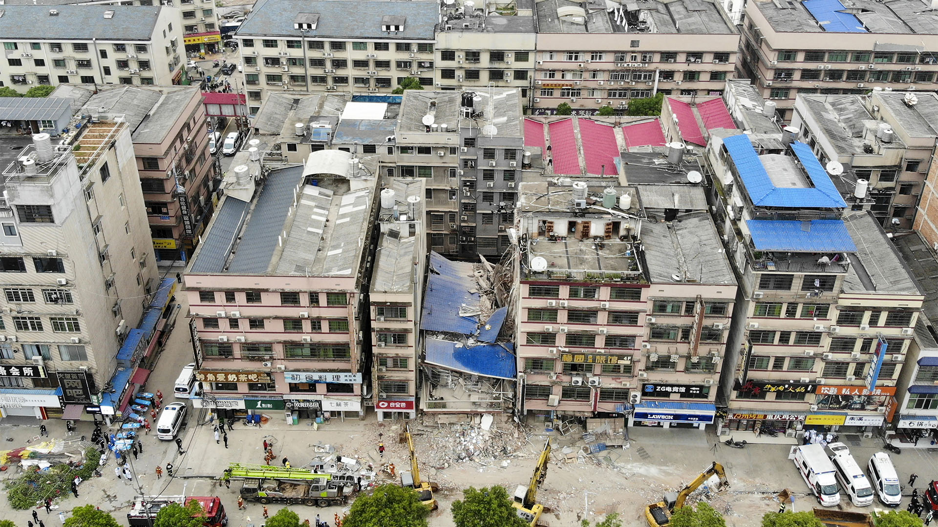 This aerial photograph taken on April 29, 2022 shows rescuers working after a six-storey building collapsed in Changsha, in China's central Hunan province. (Photo by CNS / AFP) / China OUT