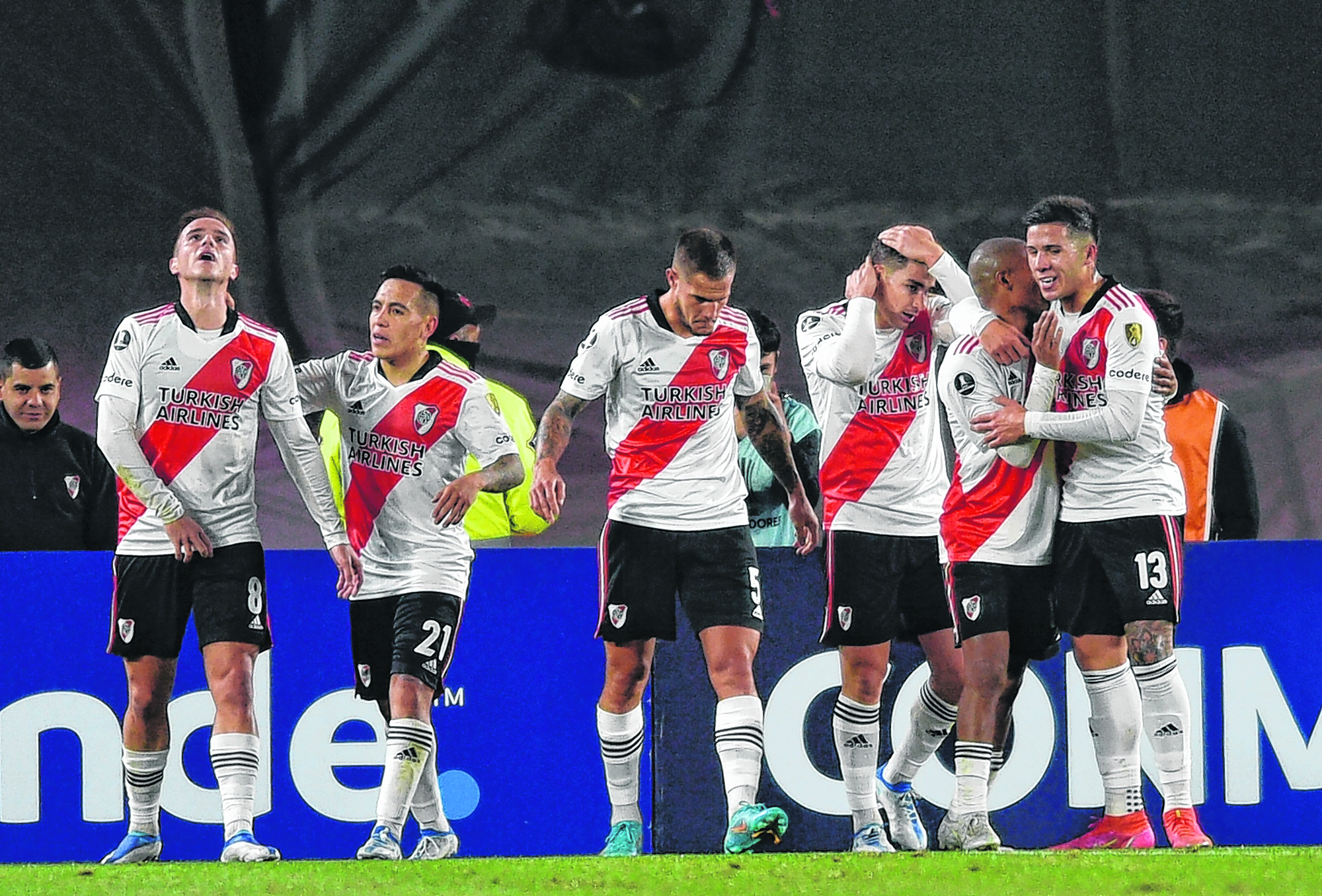 Agustin Palavecino of Argentina's River Plate, left, celebrates with teammates after scoring his side's opening goal during a Copa Libertadores soccer match against Chile's Colo Colo at Antonio Liberti Vespucio stadium in Buenos Aires, Argentina, Thursday, May 19, 2022. (AP Photo/Gustavo Garello)