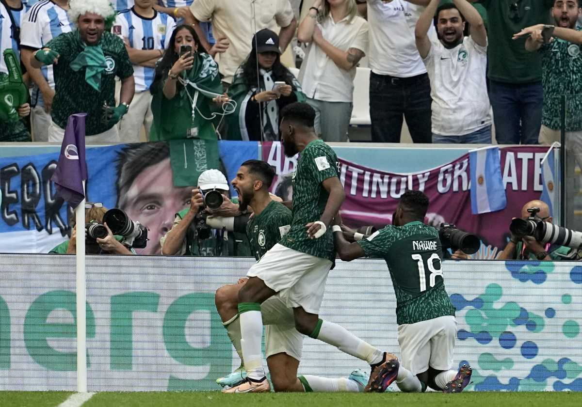 Saudi Arabia's Saleh Al-Shehri, left, celebrates with teammates after scoring his side's first goal during the World Cup group C soccer match between Argentina and Saudi Arabia at the Lusail Stadium in Lusail, Qatar, Tuesday, Nov. 22, 2022. (AP Photo/Ebrahim Noroozi)