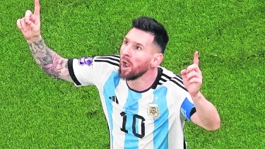 Argentina's Lionel Messi celebrates scoring his side's first goal during the World Cup final soccer match between Argentina and France at the Lusail Stadium in Lusail, Qatar, Sunday, Dec. 18, 2022. (AP Photo/Thanassis Stavrakis)
