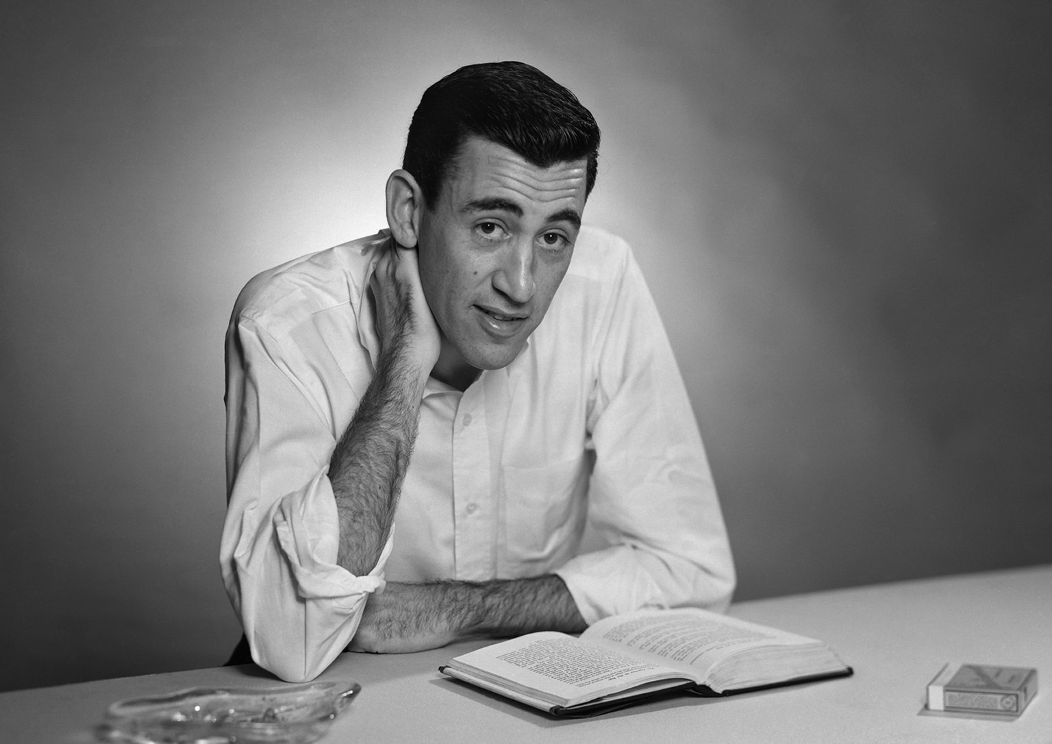 NEW YORK - NOVEMBER 20, 1952: Author JD Salinger poses for a portrait as he reads from his classic American novel "The Catcher in the Rye" on November 20, 1952 in the Brooklyn borough of New York City. Salinger died on January 27, 2010. (Photo by Antony Di Gesu/San Diego Historical Society/Hulton Archive Collection/Getty Images)