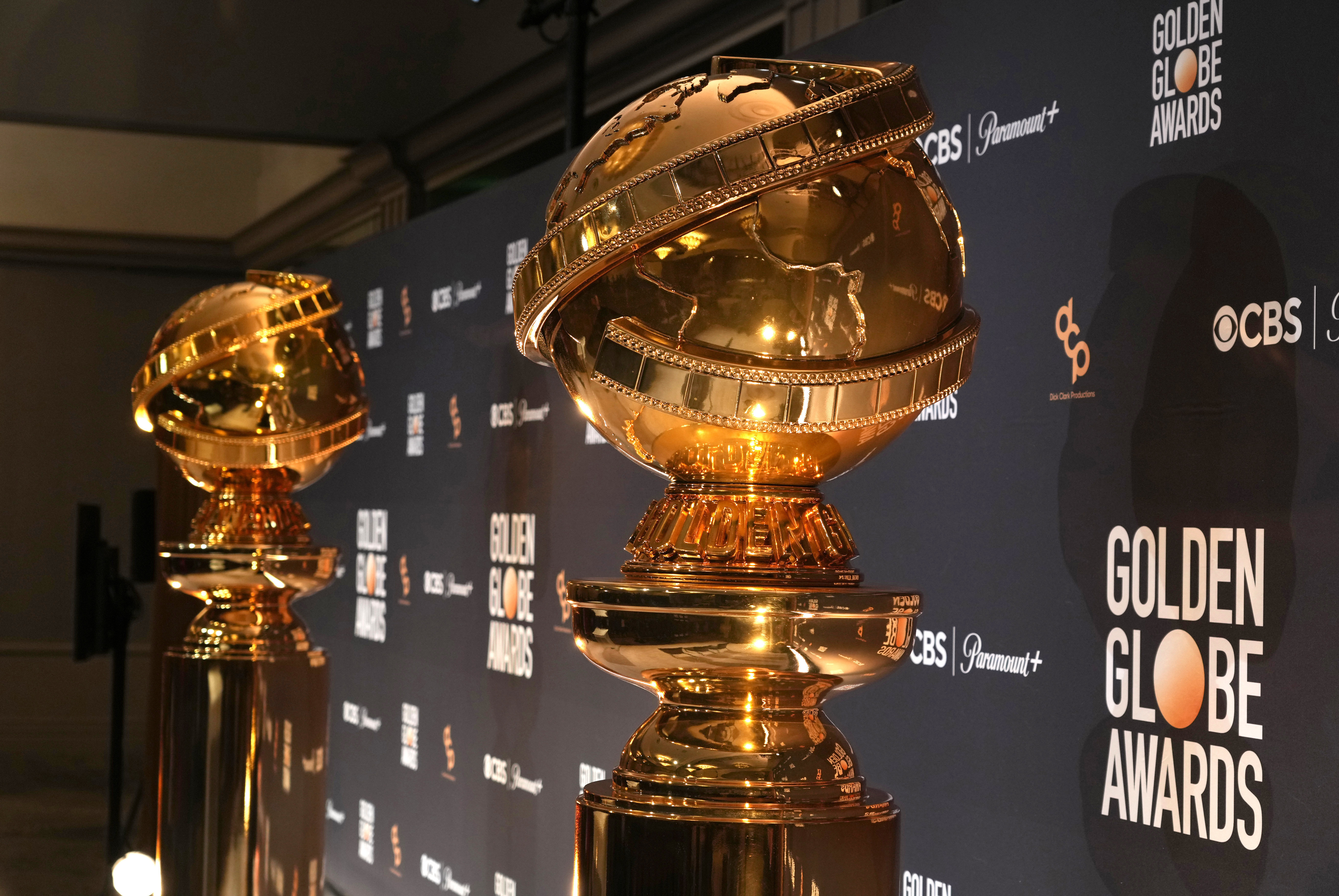 FILE - Replicas of Golden Globe statues appear at the nominations for the 81st Golden Globe Awards at the Beverly Hilton Hotel on Monday, Dec. 11, 2023, in Beverly Hills, Calif. The 81st Golden Globe Awards will be held on Sunday, Jan. 7, 2024. (AP Photo/Chris Pizzello, File)