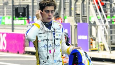 Williams driver Franco Colapinto of Argentina walks through pits during the third free practice ahead of the Formula One Mexico Grand Prix auto race at the Hermanos Rodriguez racetrack in Mexico City, Saturday, Oct. 26, 2024. (AP Photo/Moises Castillo)