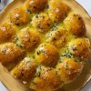 Imagen de Pancitos de ajo rellenos de queso en cinco simples pasos