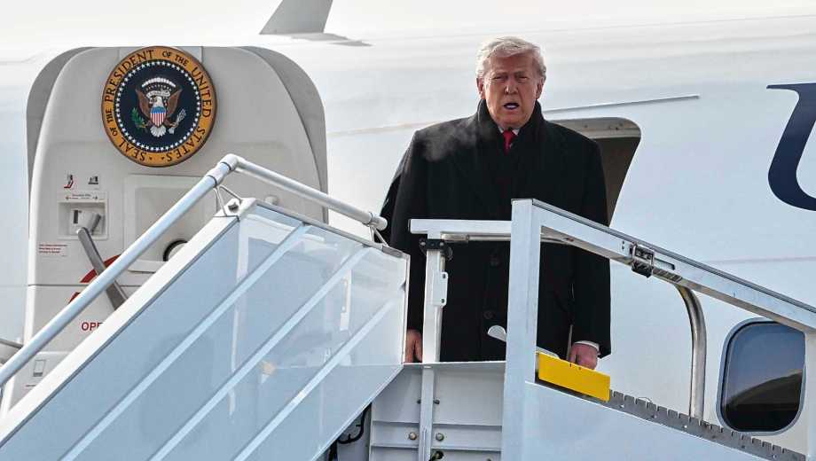 President Donald Trump steps off Air Force One after arriving at Zurich International Airport for the World Economic Forum, Wednesday, Jan. 21, 2026, in Zurich, Switzerland. (AP Photo/Evan Vucci)