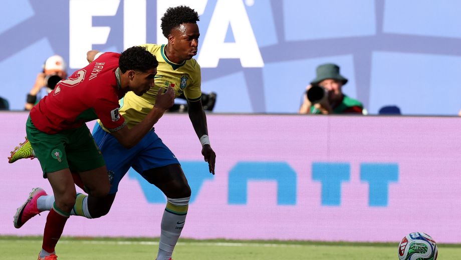 Morocco's defender #02 Achraf Hakimi (L) and Brazil's forward #07 Vinicius Junior (R) fight for the ball during the 2026 World Cup Group C football match between Brazil and Morocco at the New York/New Jersey Stadium in East Rutherford on June 13, 2026. (Photo by CHARLY TRIBALLEAU / AFP)