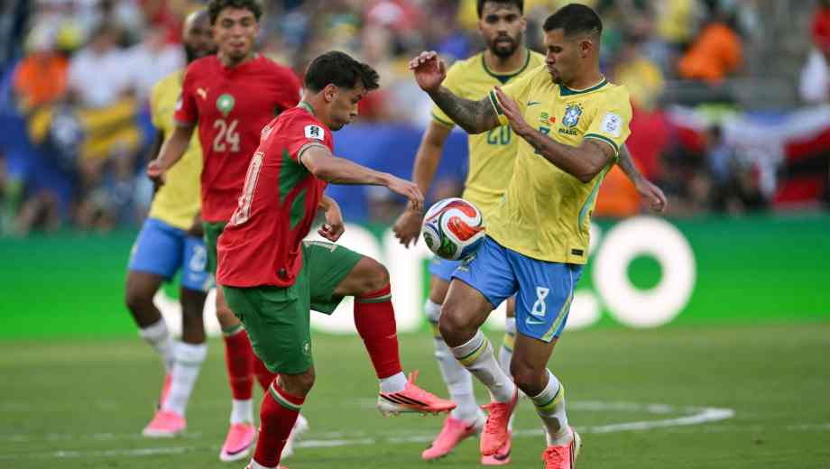 Morocco's forward #10 Brahim Diaz and Morocco's midfielder #08 Azzedine Ounahi fight for the ball during the 2026 World Cup Group C football match between Brazil and Morocco at the New York/New Jersey Stadium in East Rutherford on June 13, 2026. (Photo by Mauro PIMENTEL / AFP)