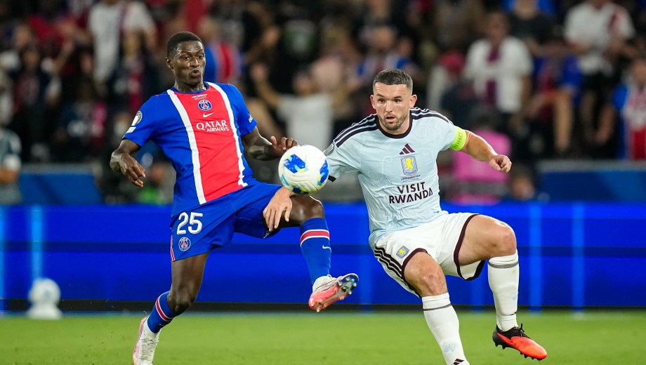 PSG's Nuno Mendes, left, challenges for the ball with Aston Villa's John McGinn during the UEFA Super Cup soccer match between Paris Saint-Germain and Aston Villa in Salzburg, Austria, Wednesday, Aug.12, 2026. (AP Photo/Darko Bandic)